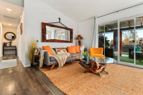 a living room with a couch and a table at Casa Luisa Joshua Tree in Joshua Tree