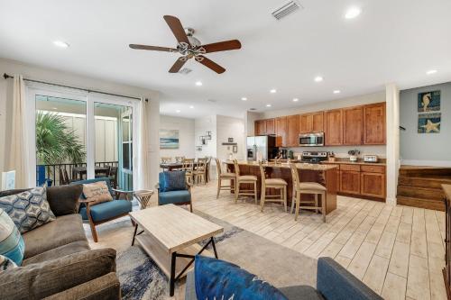 a living room with a couch and a table at PRIME True Blue Walk to Beach Pool Pets Near The Hangout Parking in Gulf Shores