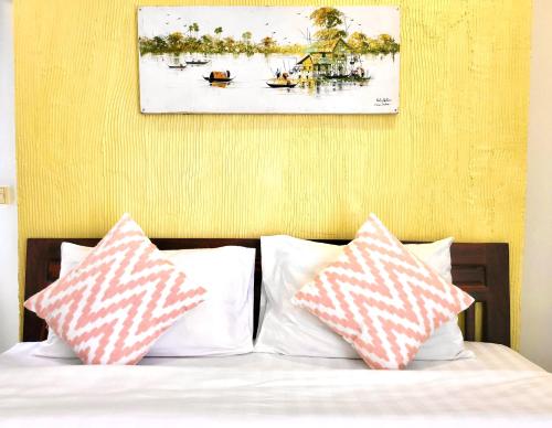 Кровать или кровати в номере Vista Angkor Residence
