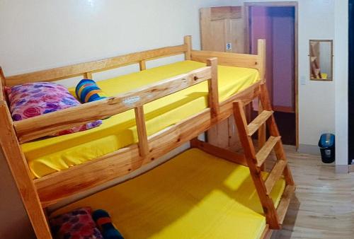 a pair of bunk beds in a room at Sagada Younganaut Lodge in Sagada