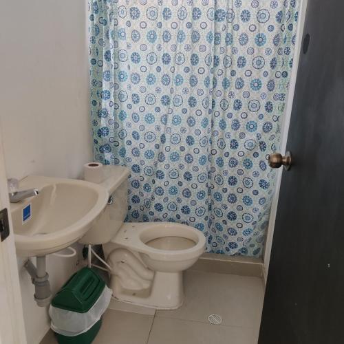 a bathroom with a toilet and a sink and a shower at Conjunto Buganviles - Casa No 7 o 3 in Girardot