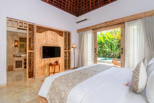 Un ou plusieurs lits dans un hébergement de l'établissement Weda Cita Resort and Spa by Mahaputra