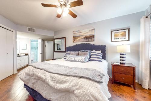 a bedroom with a bed and a ceiling fan at Gulf Point Condominiums #1314 in South Padre Island
