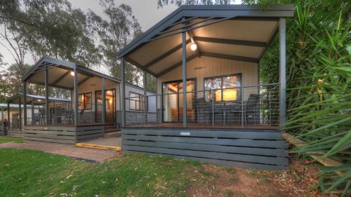 a house with a screened in porch at Moama Riverside Holiday Park in Moama