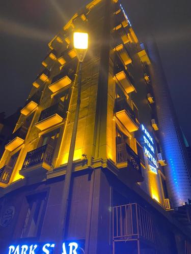 a building with a street light in front of it at Park Star Hotel Taksim in Istanbul