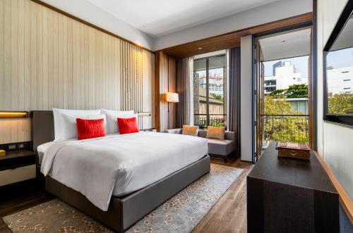 Postel nebo postele na pokoji v ubytování Villa Deva Resort & Hotel Bangkok