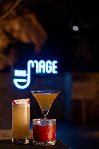 two cocktails sitting on top of a table at Hyatt Hyderabad Gachibowli in Hyderabad