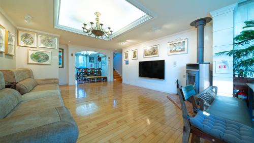 a living room with a couch and a fireplace at Museum Stay in Yongin