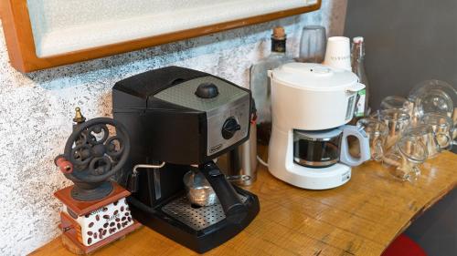 a coffee maker sitting on top of a counter at Museum Stay in Yongin
