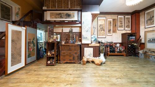 a room with paintings and pictures on the walls at Museum Stay in Yongin