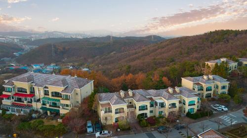 an aerial view of a group of houses on a hill at Museum Stay in Yongin