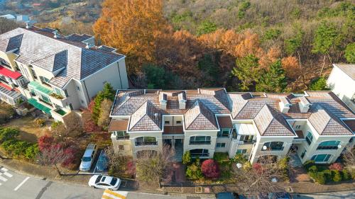 an aerial view of a large house with roofs at Museum Stay in Yongin