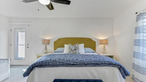 a bedroom with a bed with a green headboard at Play & Gather in Luxury,Pets too! Close to it Everything! in Orem