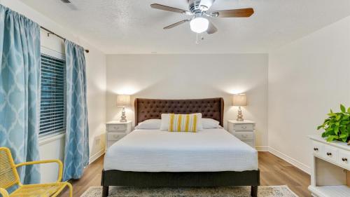 a bedroom with a bed and a ceiling fan at Play & Gather in Luxury,Pets too! Close to it Everything! in Orem