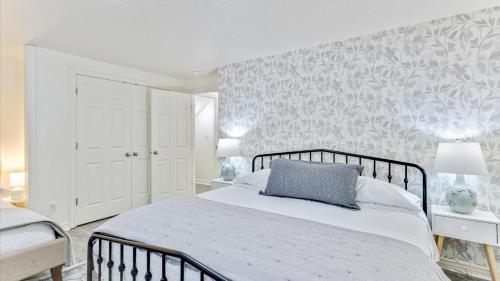 a bedroom with a bed with a blue pillow on it at Play & Gather in Luxury,Pets too! Close to it Everything! in Orem