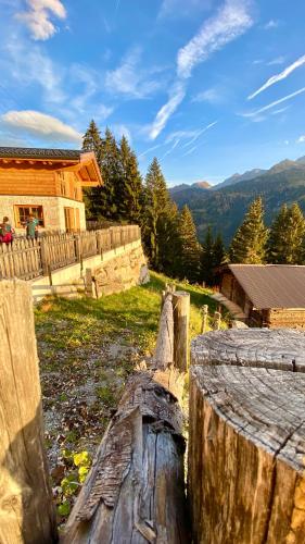 a wooden fence in front of a house at Wieslhütte in Gerlosberg