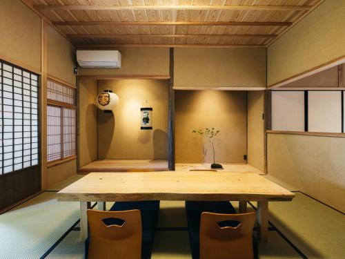 a small room with a table and chairs at RITA Yame Fukushima in Yame