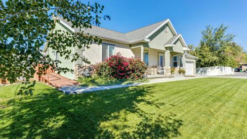 a house with a lawn in front of it at Play & Gather in Luxury,Pets too! Close to it Everything! in Orem
