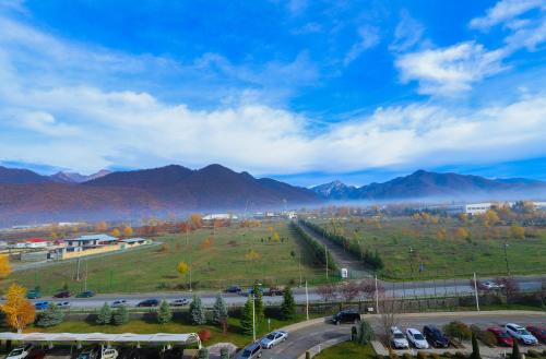 a view of a parking lot with mountains in the background at Gabala Garden Hotel in Gabala