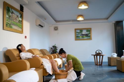two women sitting in chairs in a waiting room at Sonata Resort & Spa in Phan Thiet