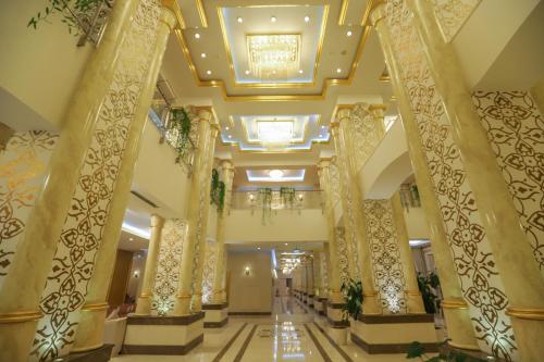 a lobby of a hotel with columns and a ceiling at Gabala Garden Hotel in Gabala