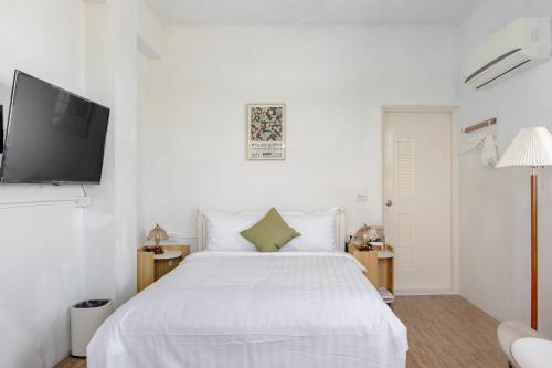 Katil atau katil-katil dalam bilik di Taitung Homeabout Pet Friendly Hall