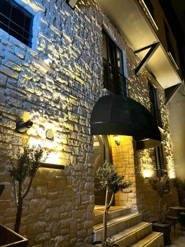 a stone building with a staircase in front of it at Mare House Boutique Hotel in Bursa