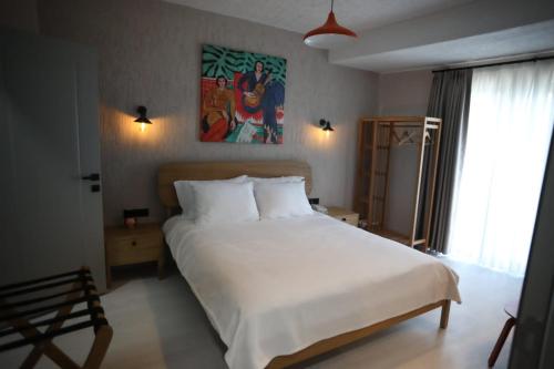 Mare House Boutique Hotelにあるベッド