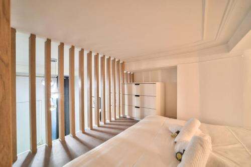 Posteľ alebo postele v izbe v ubytovaní Bel appartement au coeur de Montmartre