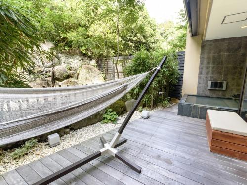 a hammock in the middle of a patio at Fufu Atami in Atami