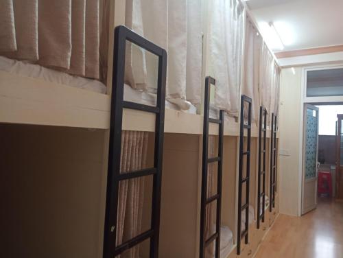 a row of bunk beds in a dorm room at New Sleep in Dalat Hostel in Da Lat