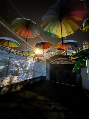 a bunch of umbrellas hanging from a ceiling at Qafqaz Fountain cottage in Gabala
