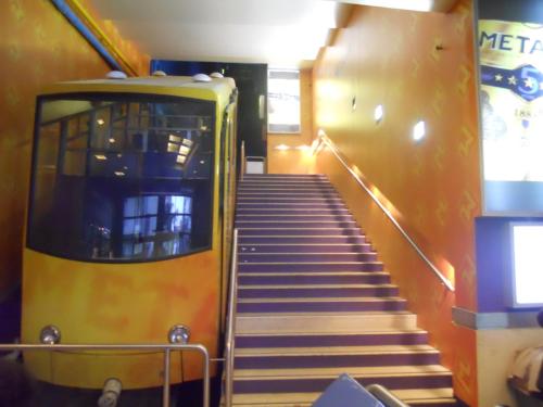 a staircase leading up to a subway train at 2 BedRoom Apt - Live Like a Local in Kolonaki in Athens