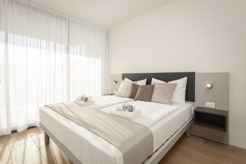 Letto o letti in una camera di Residence Del Mar Emotion