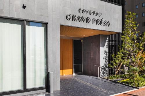a building with a sign that reads grand princess at Sotetsu Grand Fresa Kumamoto in Kumamoto