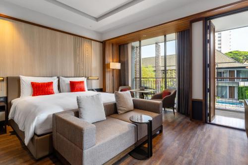 Postel nebo postele na pokoji v ubytování Villa Deva Resort & Hotel Bangkok