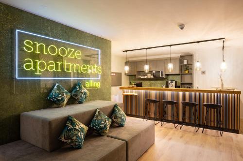 Η κουζίνα ή μικρή κουζίνα στο Snooze Apartments Alling