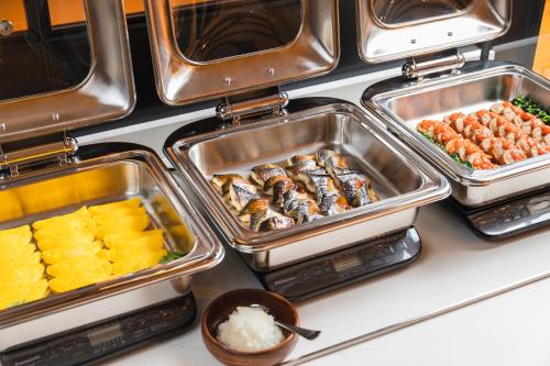 a bunch of trays of food on a counter at Sotetsu Grand Fresa Kumamoto in Kumamoto