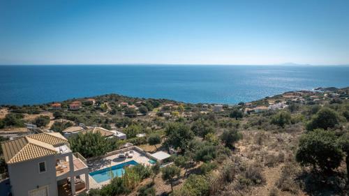 a villa with a view of the ocean at Astra Villas in Skala Kefalonias