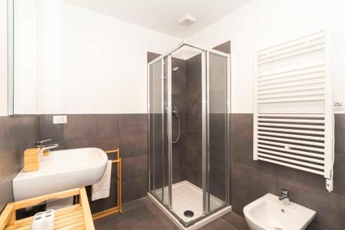 a bathroom with a shower and a sink at Urban House Carducci - Apartments in Turin