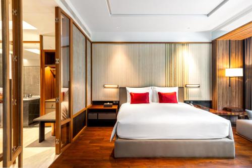 Postel nebo postele na pokoji v ubytování Villa Deva Resort & Hotel Bangkok
