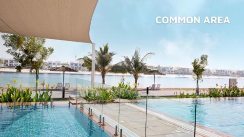 a view of the swimming pool at a resort at Beach Villas by Olala Homes in Ras al Khaimah