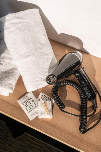 a telephone sitting on a table with a napkin at B&B HOTEL Paris Ivry Quai de Seine in Ivry-sur-Seine
