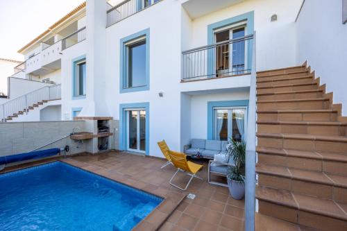 an image of a house with a swimming pool at Your Villa Algarve Private pool 5 min walk to beach in Burgau