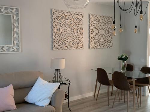 a living room with a couch and a table at La Casa de la Colonia in Seira