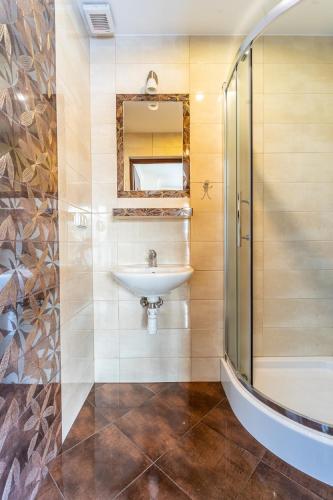 a bathroom with a sink and a shower at DW Paweł in Zakopane