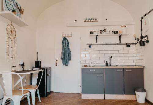 a kitchen with a sink and a counter top at Little Universe in Liptovský Mikuláš