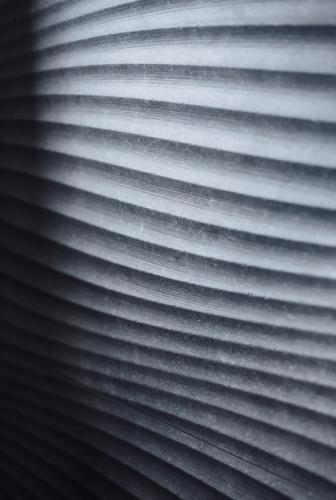a close up of a window with white blinds at Hotel Brčko gas Sarajevo in Lukavica