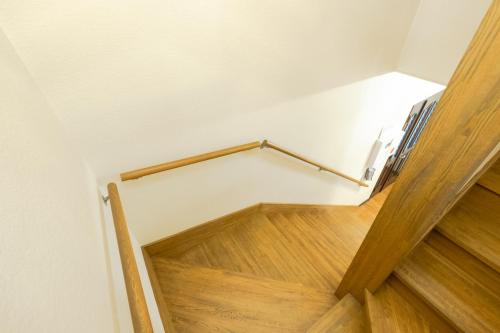 a view of a staircase with wooden floors and a railing at STAY IN ASAHIKAWA99 in Asahikawa