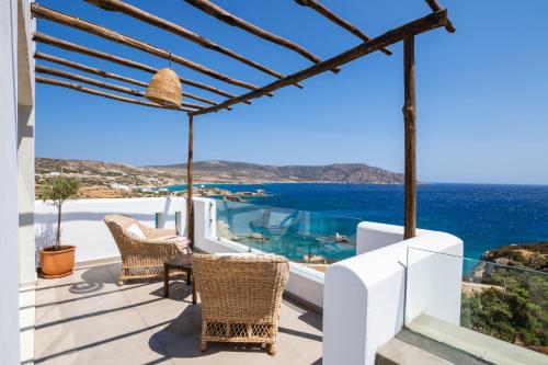 a villa with a view of the ocean at Aegean Village Beachfront Resort in Amoopi